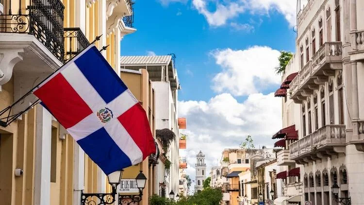 The flag of the Dominican Republic flying across its city