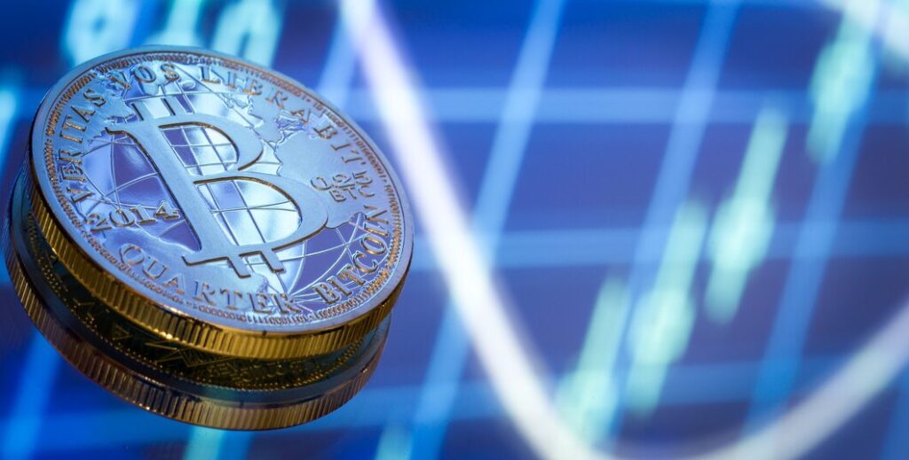 Crypto coins on blurred graph background 