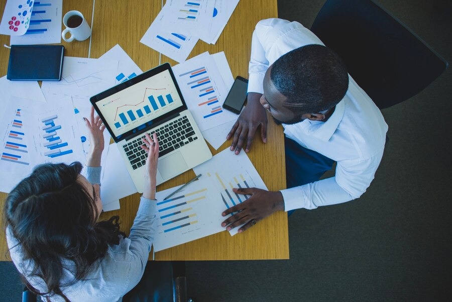 Employees looking at economic trends