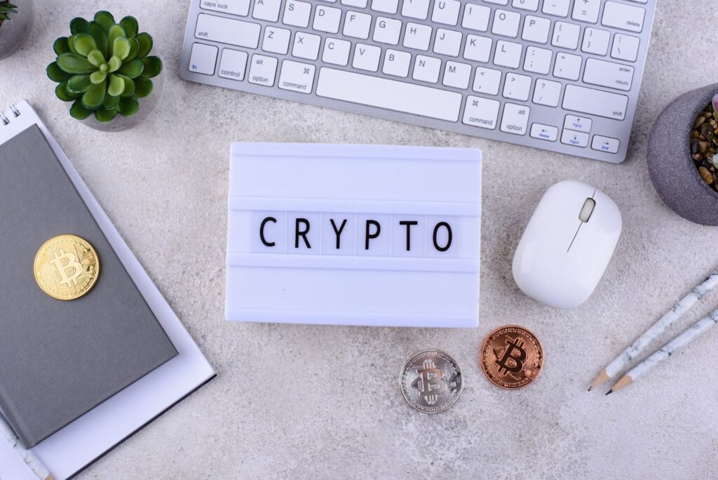 Bitcoin coins on office desk. Cryptocurrency growth concept.