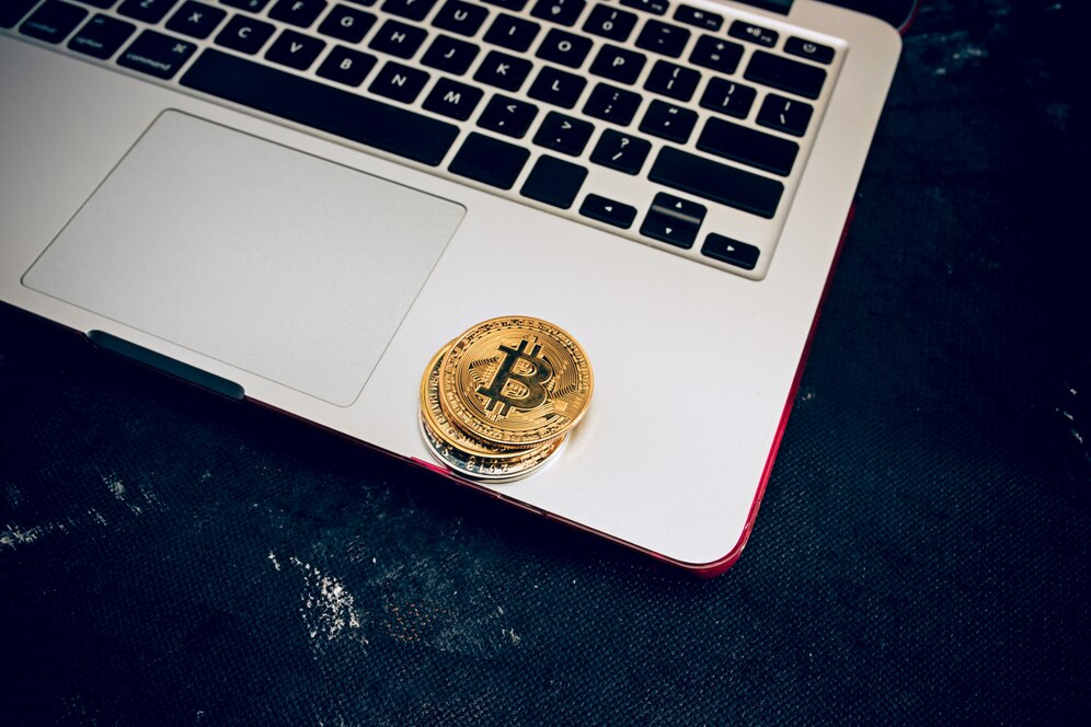 The golden bitcoin on a keyboard