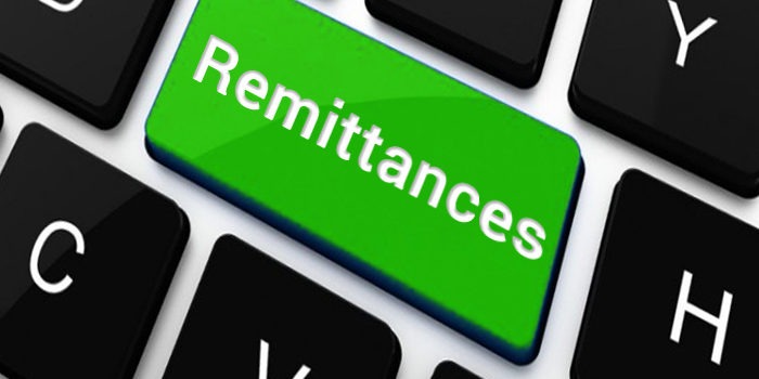 A cross-view of a keyboard with a key inscribed with 'Remittances'