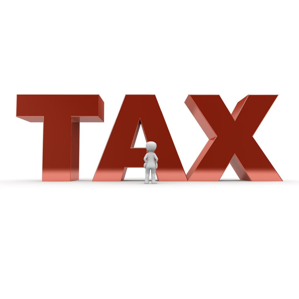 White stick figure standing in front of large, red, 3D letters saying "TAX.”