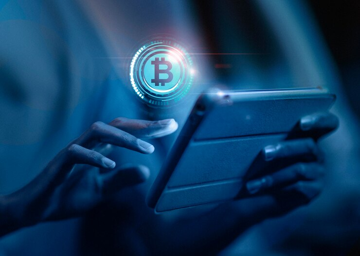 A Bitcoin hologram over a smartphone.