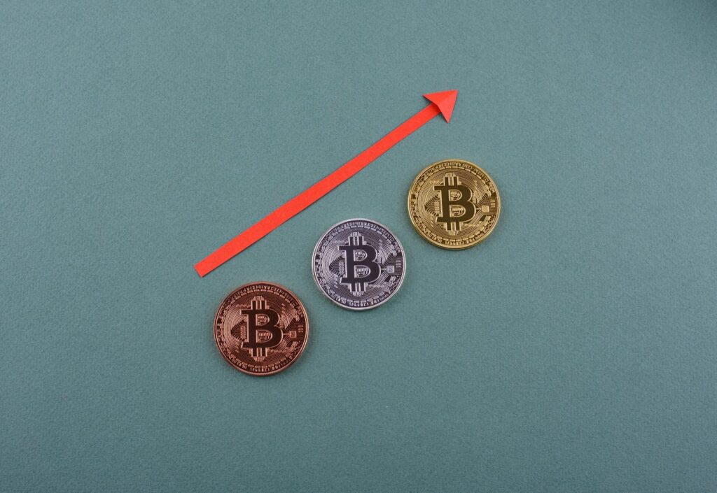 Bitcoin coins on the desk. Cryptocurrency growth and fall schedule