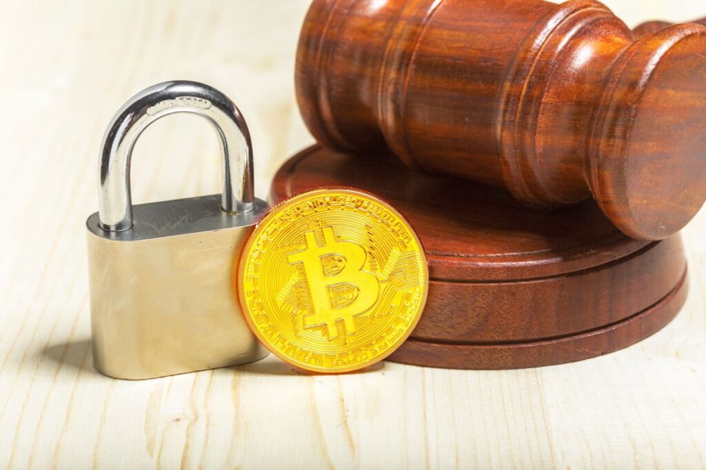 Crypto coin with wooden gravel and padlock
