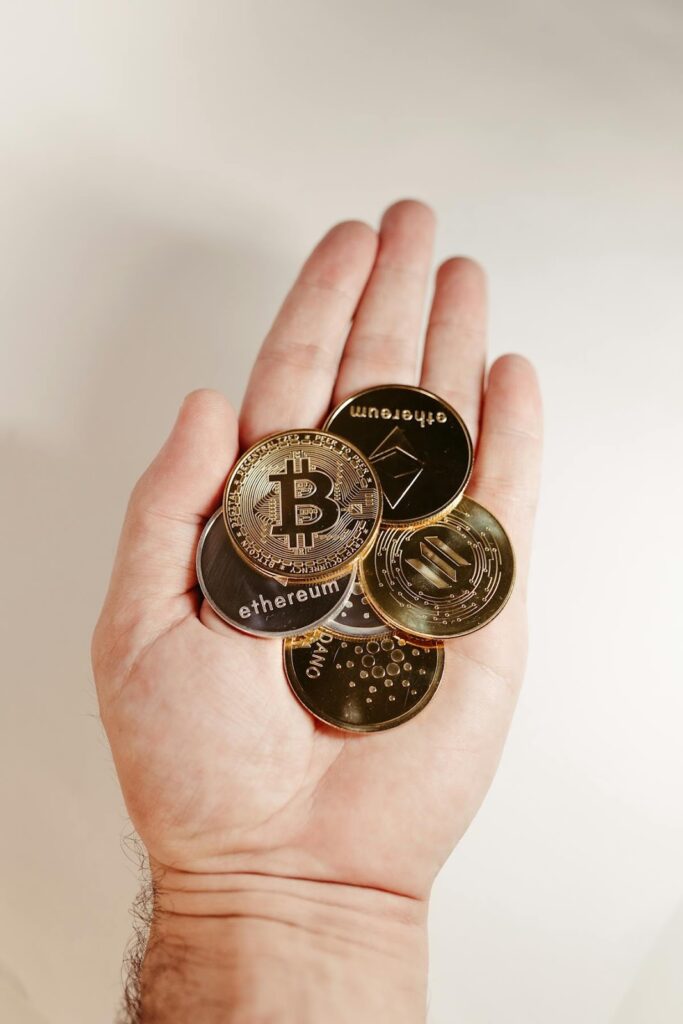 Man Holding a Gold Bitcoins