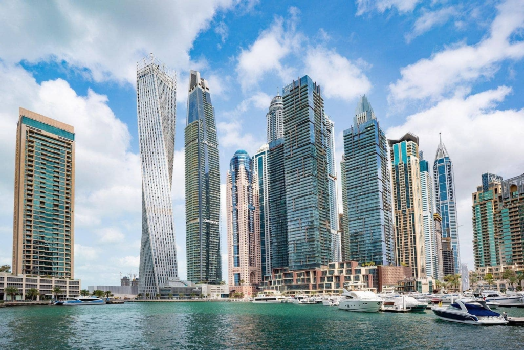 Dubai skyline showcasing luxury residential buildings and waterfront properties, representing buying a home in Dubai with cryptocurrency.